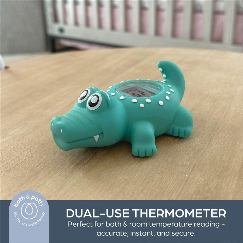 Crocodile-shaped thermometer designed for bath and room temperature reading, featuring a digital display.
