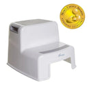 Grey and white Dreambaby 2-Up step stool with a textured surface and an award badge for excellence.
