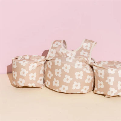 Kids float featuring a floral design in neutral tones, suitable for weights between 25-50 lbs.