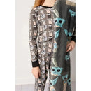 Baby Precious Cargo Bamboo Pajamas featuring playful designs of adorable characters on a gray background, worn by a child.