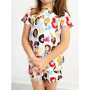 Princess-themed bamboo lounge set featuring a child wearing a short-sleeve top and shorts decorated with various princess characters.