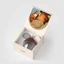 Classic glass bottle with a deep brown nipple, packaged in a box featuring an image of a baby being fed.