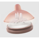 Classic glass bottle nipple in light color, featuring a soft shape with multiple openings for easy feeding.