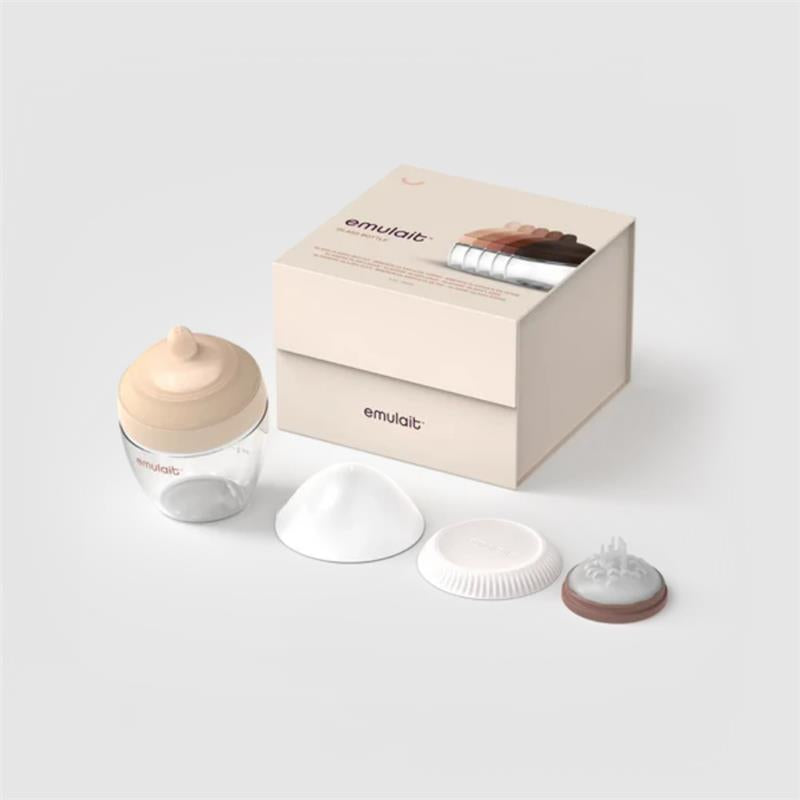 Emulait glass classic bottle with medium nipple shape and four interchangeable nipple tips beside a box.