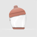 Classic glass bottle with a medium nipple and pink lid, designed for feeding infants.