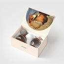 Emulait Starter Kit featuring two nipple shapes in fair color, with a closed box displaying a baby feeding.