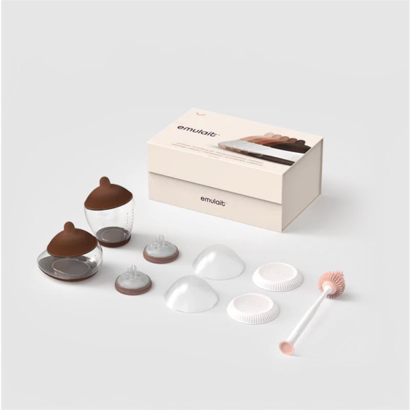Emulait Starter Kit featuring two clear nipples with brown tops, several nipple shapes, and a cleaning brush in a box.
