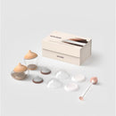 Emulait Starter Kit featuring two nipple-shaped containers, a cleaning brush, and various nipple molds.
