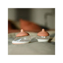 Starter kit featuring two Emulait nipples with rich color and shape 5, displayed on a soft surface.
