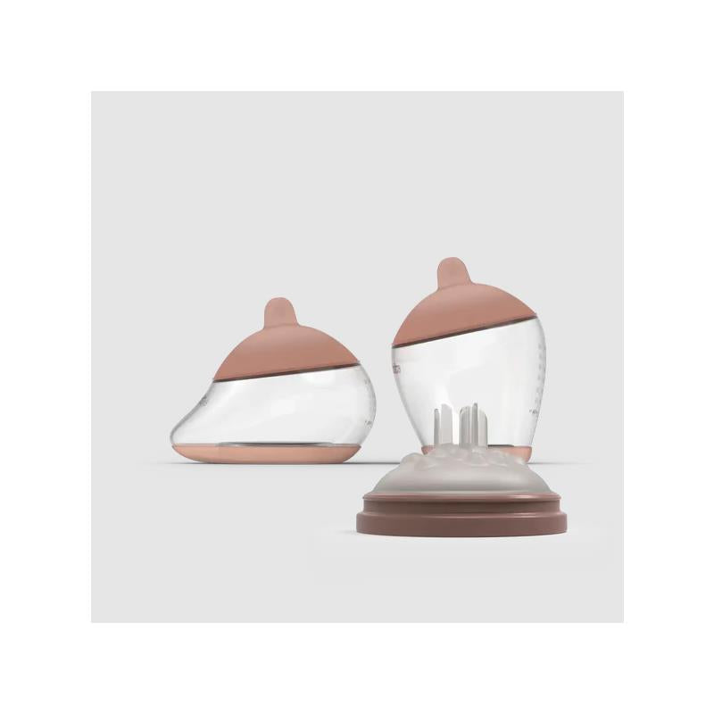 Emulait Starter Kit featuring two nipple designs: a rich color, shape 5 for comfortable feeding.