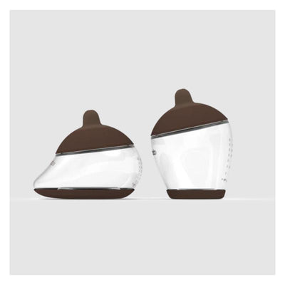 Starter Kit featuring two baby bottles with brown lids, one with a rich shape design for easier grip.