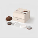 Classic bottle nipple, deep brown color, shape 5, with a clear bottle and additional interchangeable parts displayed beside the box.