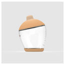 Classic bottle nipple in light color with a soft, rounded shape, featuring measurement markings on a clear body.