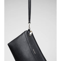Sleek black Enya Mond Nova Bag in Onyx, featuring a zipper and a detachable strap.