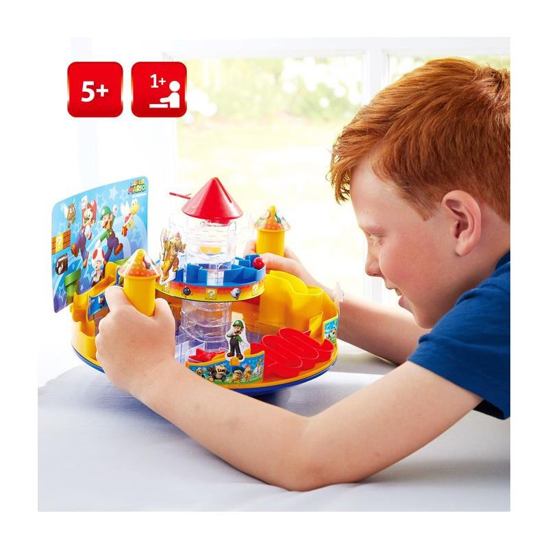 A child engages with the Epoch - Bl Super Mario Castle Land playset featuring colorful towers, figures, and interactive elements.