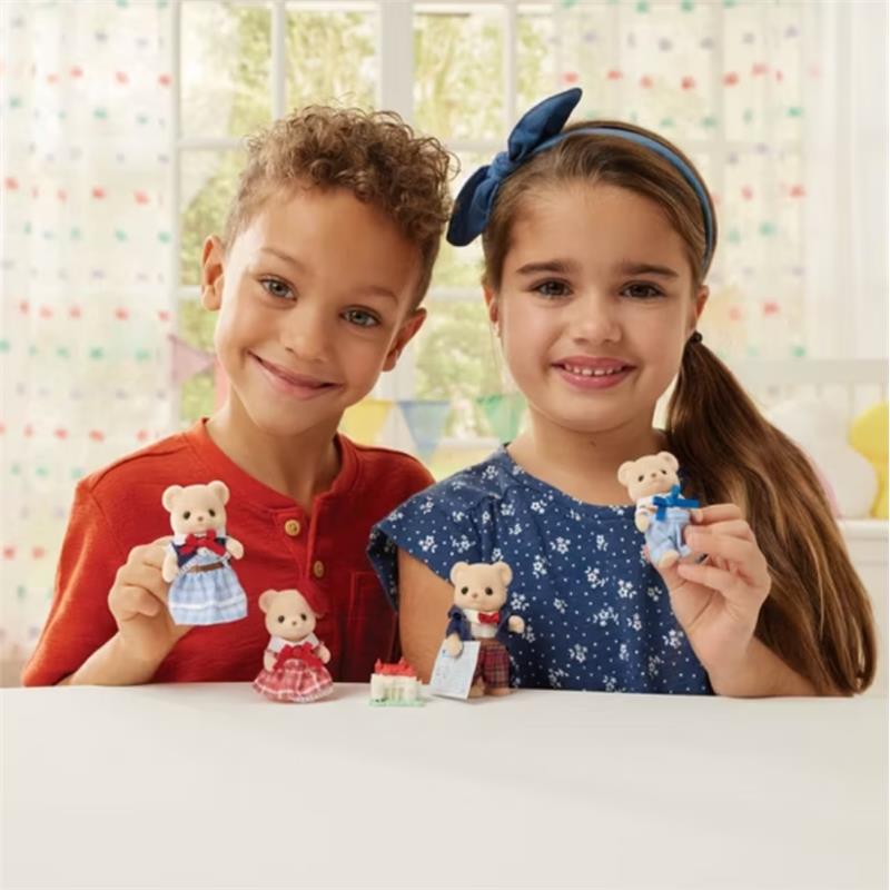 Children showcase the Epoch Calico Critters Biscuit Bear Family toys, displaying three bears in colorful outfits.
