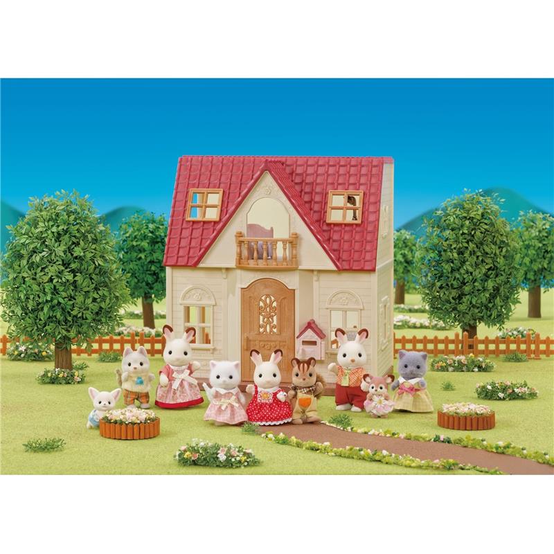 Epoch Calico Critters Red Roof Home Cozy Cottage 2026 Edition dollhouse with various animal figures in festive outfits.