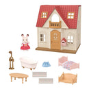 Epoch Calico Critters Red Roof Home Cozy Cottage 2026 Edition dollhouse with furniture and a bunny figure.