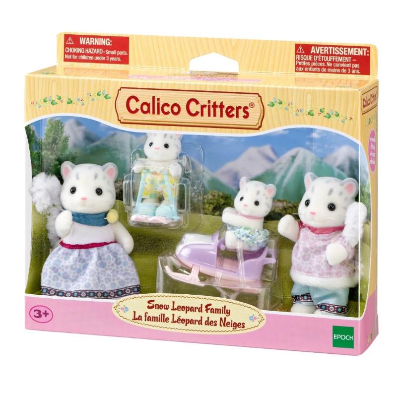 Snow Leopard Family figurines from Calico Critters, featuring three dressed dolls and a purple sled in a scenic background.