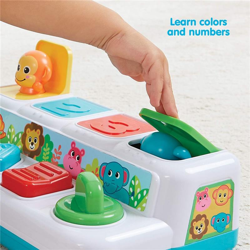 Colorful toy with animal shapes to learn colors and numbers; a child’s hand interacts with the green lid.
