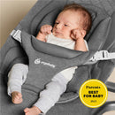 Ergobaby Evolve 3-in-1 Bouncer Seat in charcoal grey with a baby comfortably seated, wearing a white shirt and grey pants.