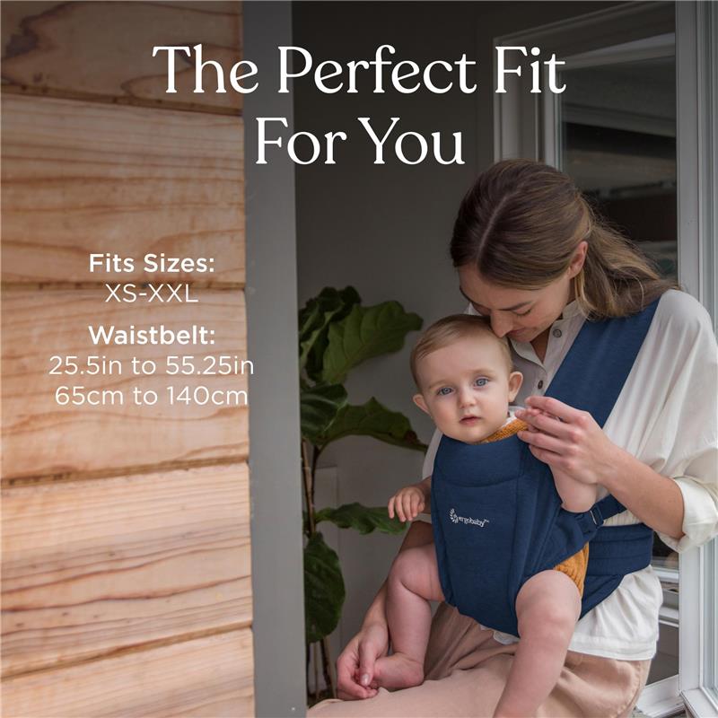 Ergobaby Embrace newborn baby carrier in navy worn by a woman holding an infant, featuring size and waistbelt specifications.