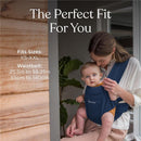 Ergobaby Embrace newborn baby carrier in navy worn by a woman holding an infant, featuring size and waistbelt specifications.
