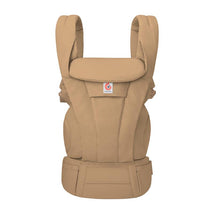 Ergobaby Omni Deluxe Baby Carrier in camel cotton, suitable for newborns to toddlers, featuring padded shoulder straps and a supportive waist belt.
