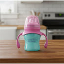 Evenflo Feeding 5 Oz Balance Sippy Cup in pink and purple, designed for babies 6 months and older, with easy-grip handles.