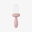 Baby-led weaning feeder in blush color with a transparent top, designed for safe and easy feeding.