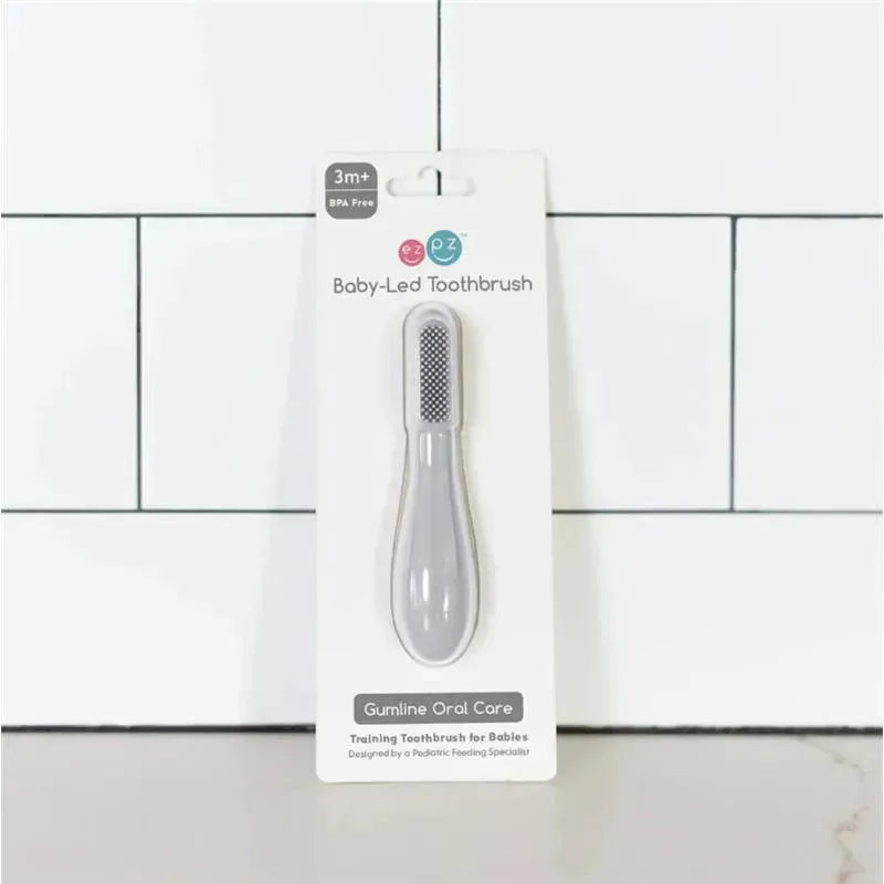Baby-Led™ Toothbrush in pewter color, designed for babies 3 months and older, with gumline care features.