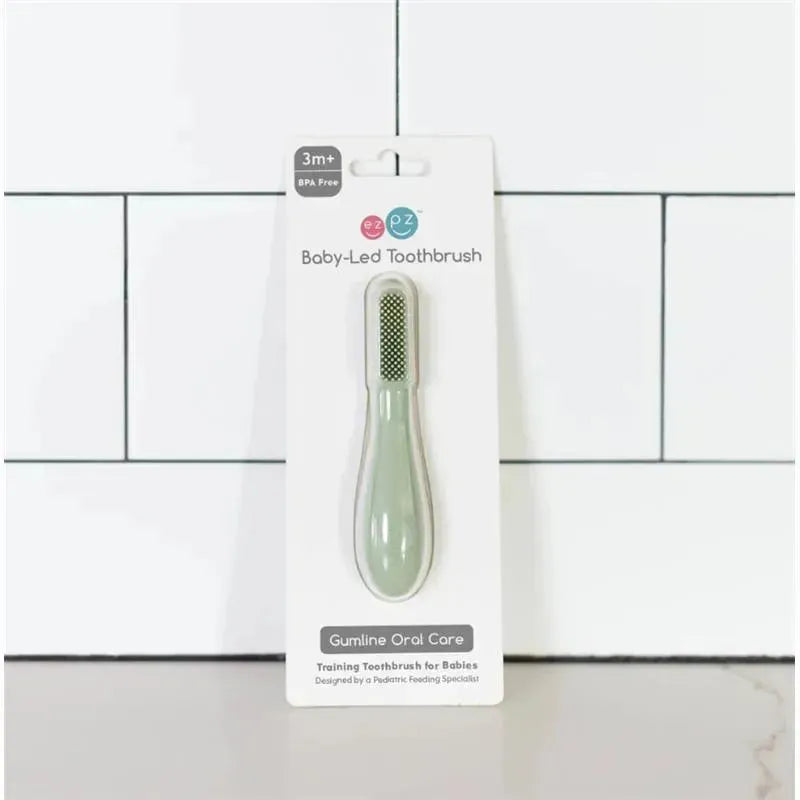 Ezpz Baby-Led Toothbrush in sage color, designed for babies 3 months+, featuring a textured bristle head and BPA-free packaging.