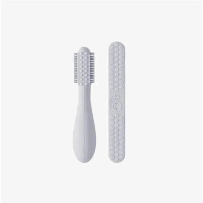 Ezpz Baby-Led Toothbrush and Sensory Tongue Depressor Dual Pack in pewter, featuring a textured toothbrush and smooth depressor.