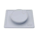 Ezpz Mini Bowl Lid in pewter color, featuring a circular bowl on a square base designed to prevent spills.
