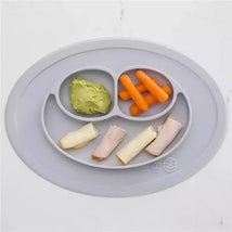 Ezpz Mini Mat in pewter with sections holding avocado, carrot sticks, and turkey rolls, showcasing its divided design for toddlers.