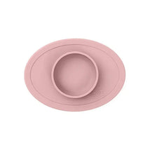 Silicone bowl in blush color designed for children, featuring a raised edge and a central food compartment.