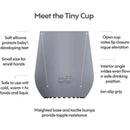 Pewter-colored Ezpz Tiny Cup designed for toddlers, featuring a weighted base, non-slip grip, and ergonomic shape for safe drinking.