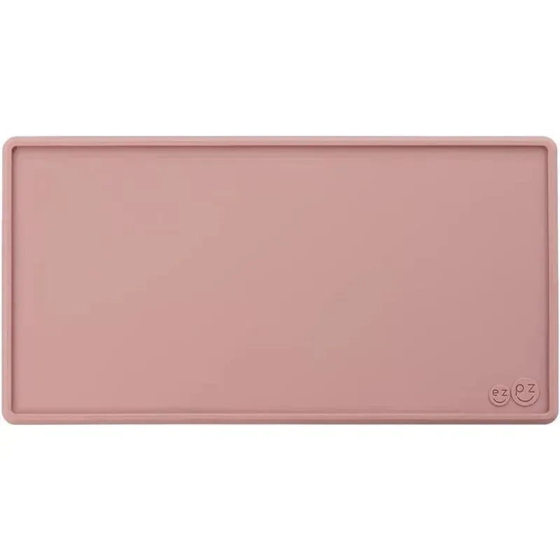 Tiny placemat in blush color by Ezpz, designed to catch spills and keep mealtime messes minimal.