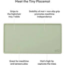 Tiny placemat in sage green designed to grip highchair trays, featuring a high lip to contain messes and promote independence during meals.