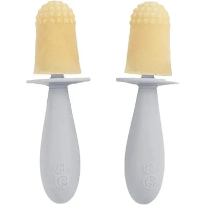 Tiny Popsicle mold set featuring two gray wands with textured, light-colored popsicles on top.