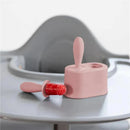 Tiny Popsicle mold set in pink blush with wands, featuring a completed popsicle filled with red, fruity texture.