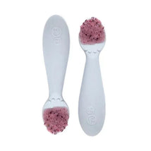 Ezpz Tiny Spoon Twin-Pack in pewter color, featuring two spoons with pink food on the tips.