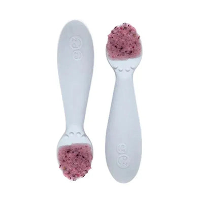 Ezpz Tiny Spoon Twin-Pack in pewter color, featuring two spoons with pink food on the tips.