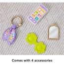 Fisher Price Laugh & Learn Purse with four colorful accessories: a phone, mirror, flower rattle, and scarf.