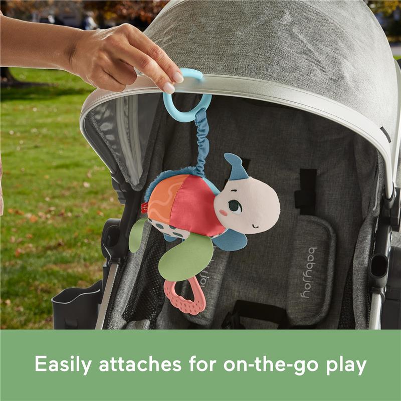 Plush turtle toy with a teether, easily attaches to stroller for on-the-go play; features bright colors and textured elements.