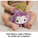 Purple plush monkey toy with satiny ribbons and crinkle ear, designed for sensory play in infants.