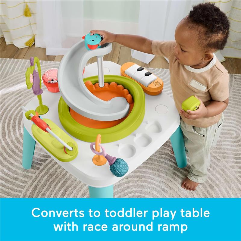 Fisher-Price Baby to Toddler Toy 2-in-1 purple monkey activity center with ramp, colorful toys, and a child playing.