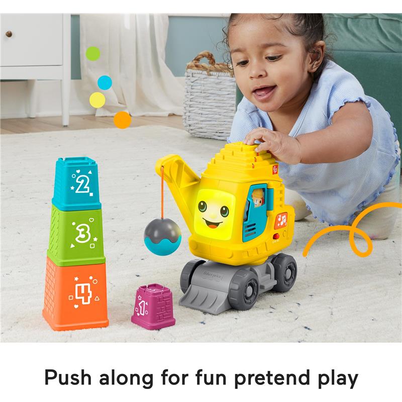Fisher Price Count & Stack Crane toy with colorful stacking blocks; a child plays with the smiling crane and its hanging ball.