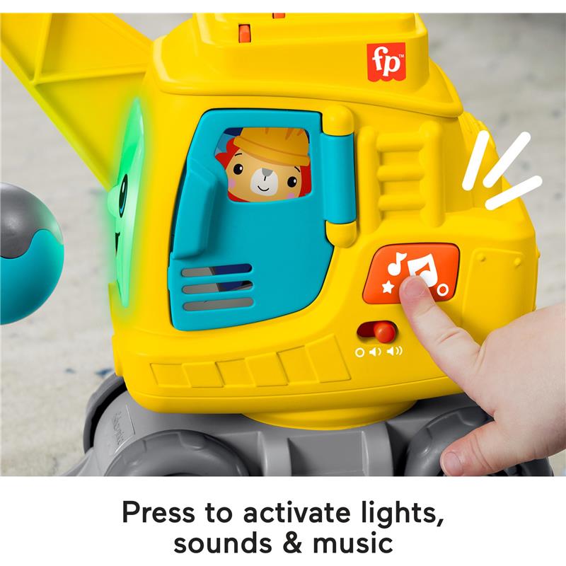Bright yellow crane toy with a character inside, featuring a button pressed to activate sounds and lights.
