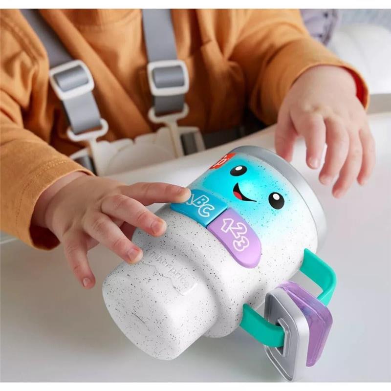 Musical activity coffee mug toy for toddlers, featuring smiling face, buttons with letters and numbers, and colorful handle.